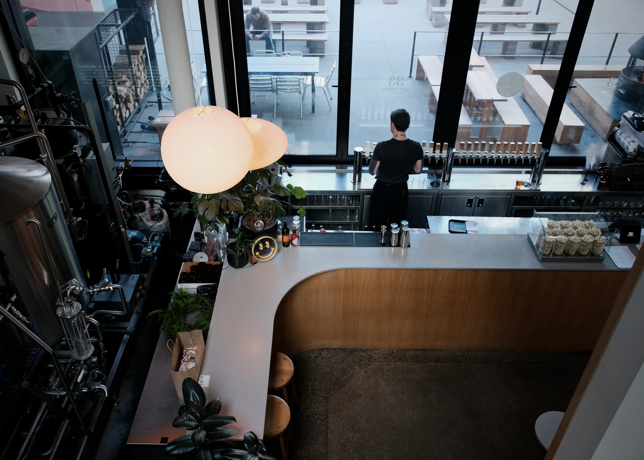 Bartender preparing a modern venue before service