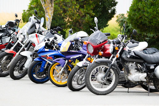A row of colorful motorcycles parked outside.