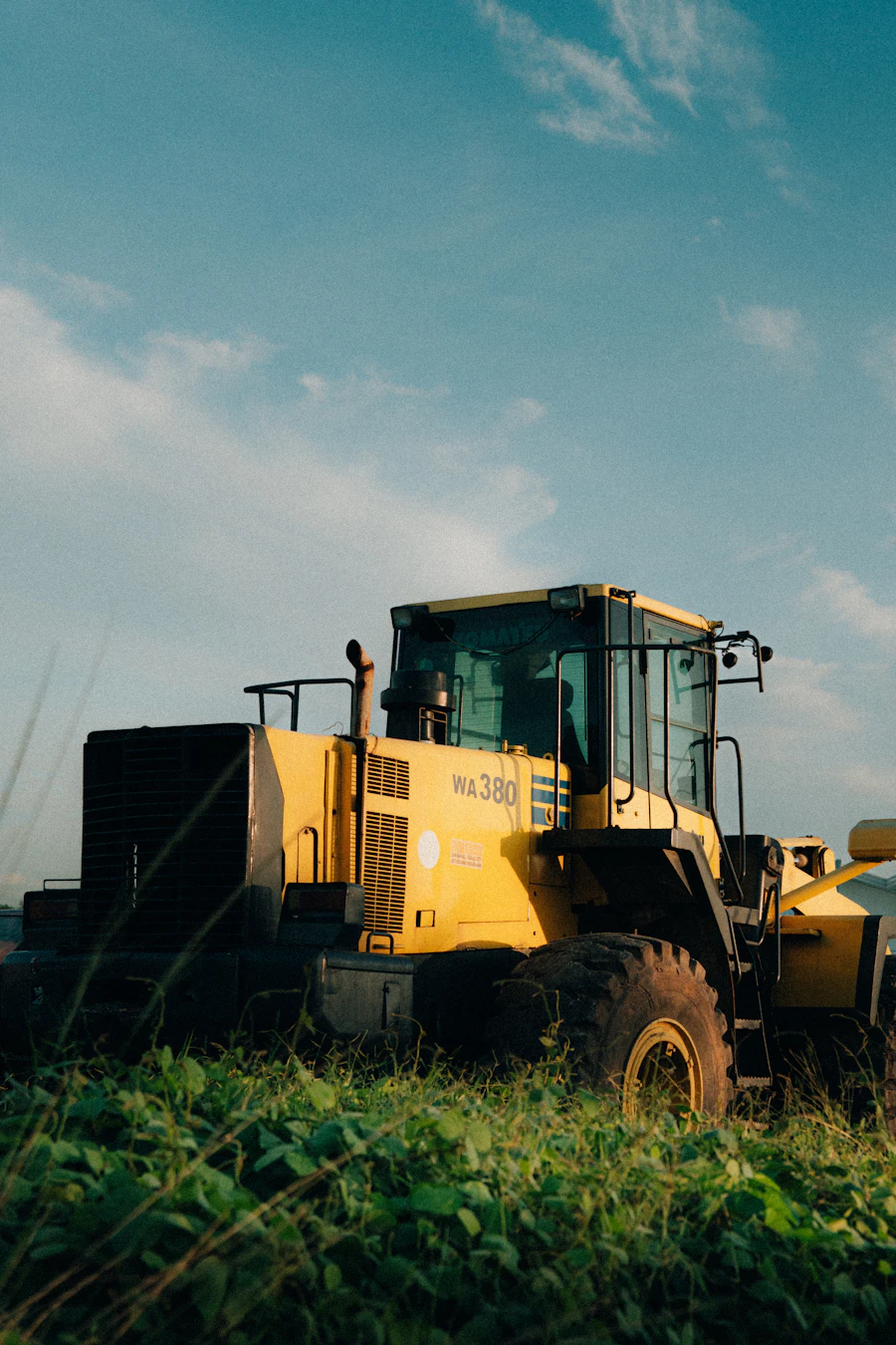Wheel loader parked near a gravel pile