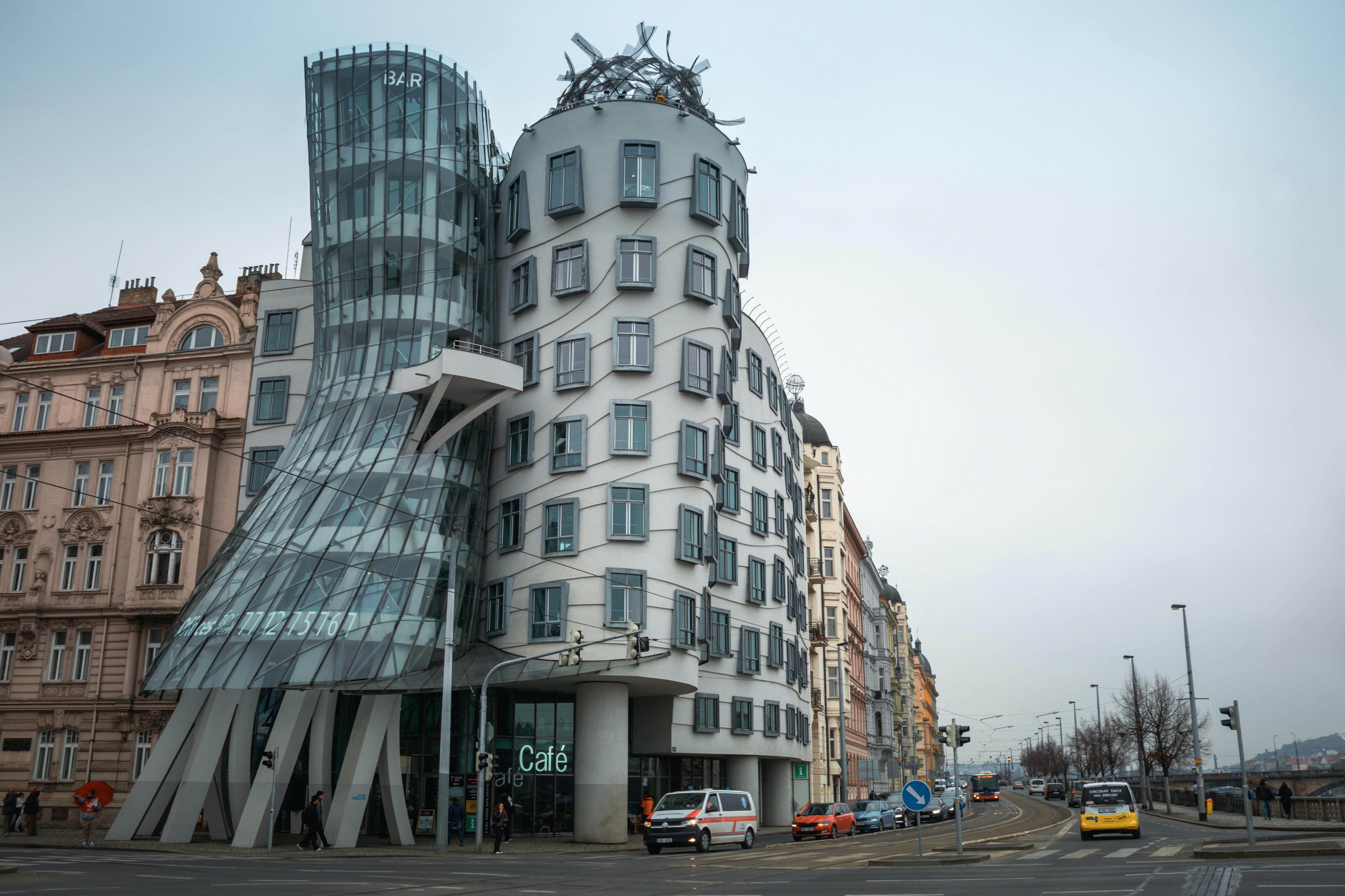 Modern dancing house building on city street