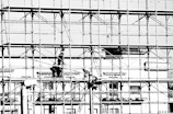 Workers on scaffolding at a construction site.