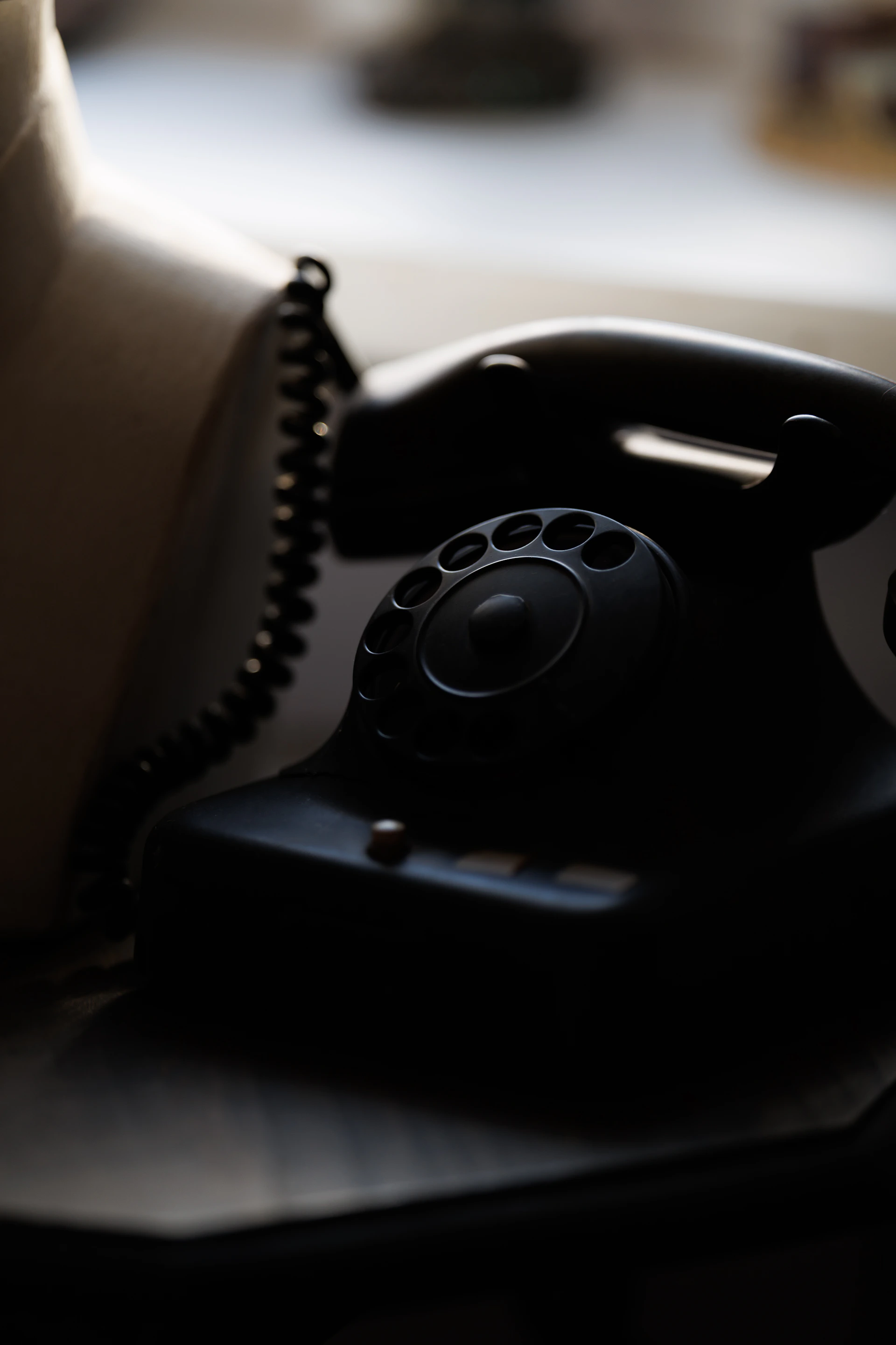 A vintage black rotary dial telephone