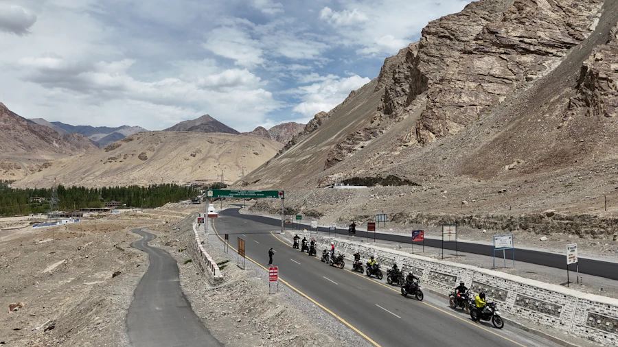 Group of motorcyclists riding a winding mountain road