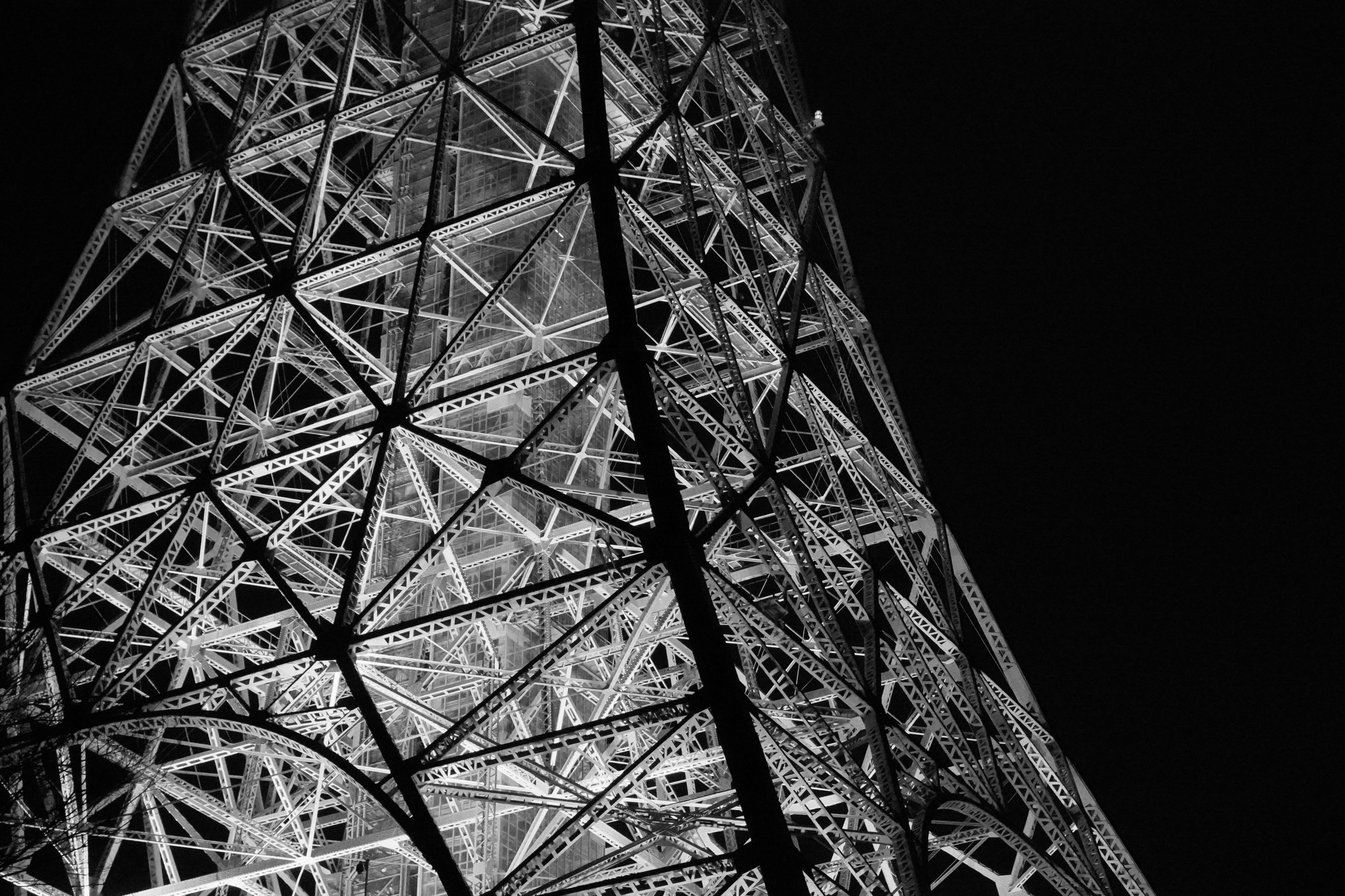 Abstract geometric pattern of a metal tower at night