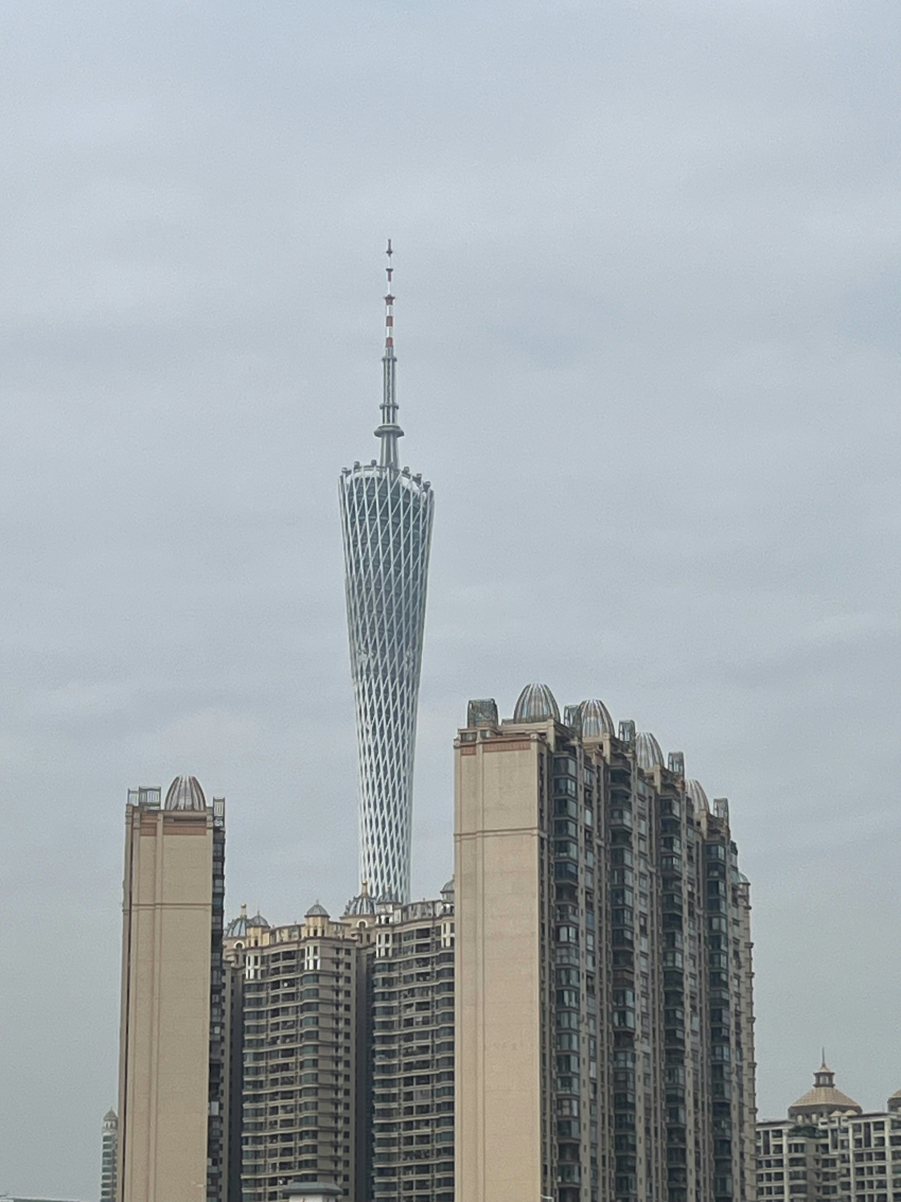 Canton tower rises above apartment buildings