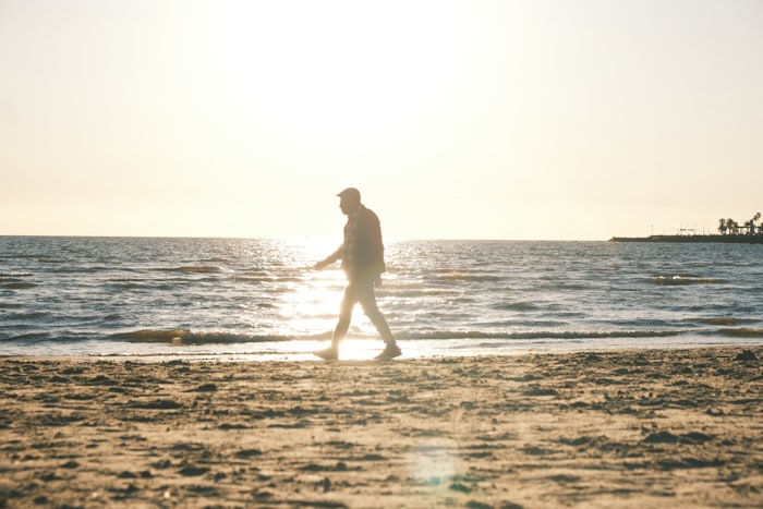 A figure walking at first light