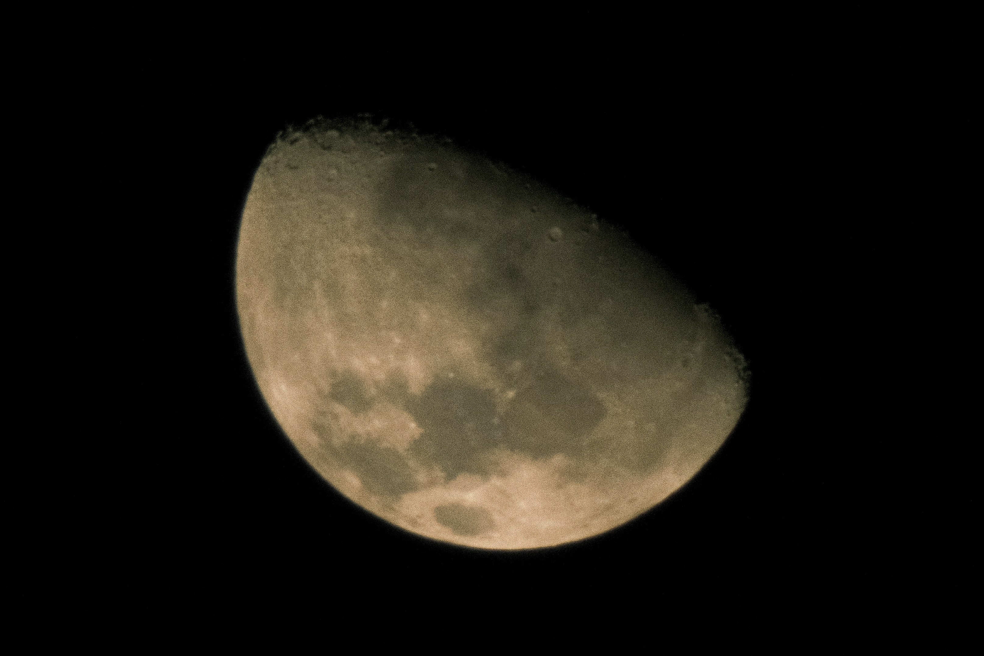 A crescent moon against a black sky