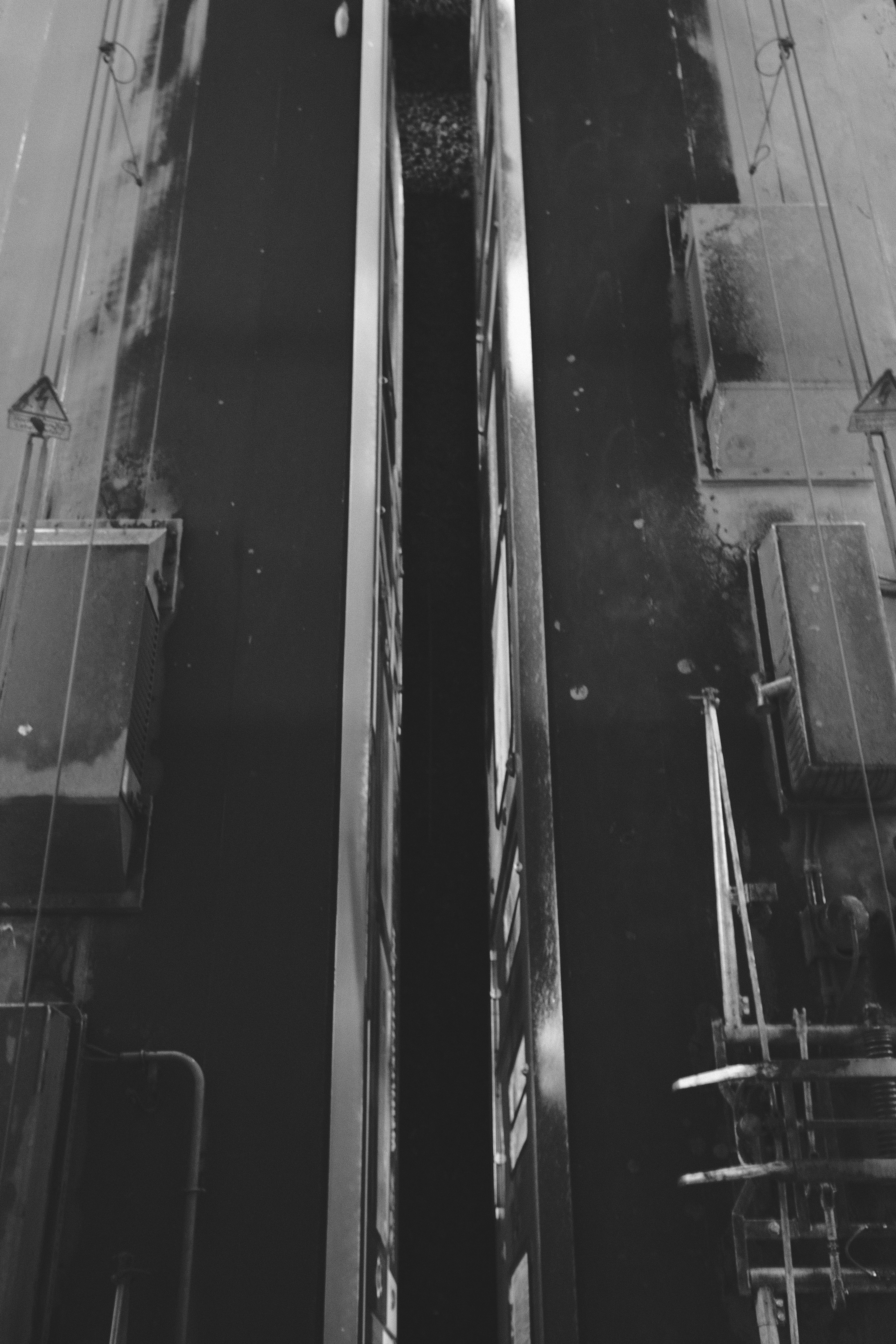 Two parallel buildings with a dark gap between them