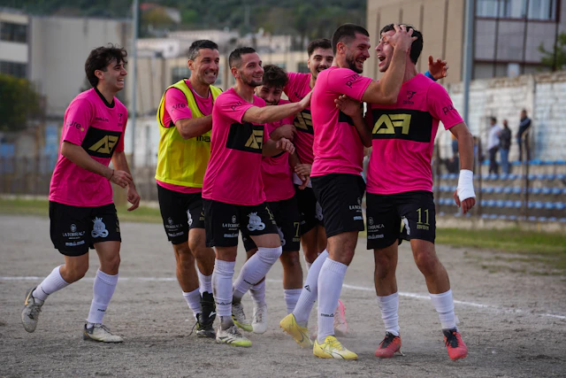 A team celebrating a scored goal