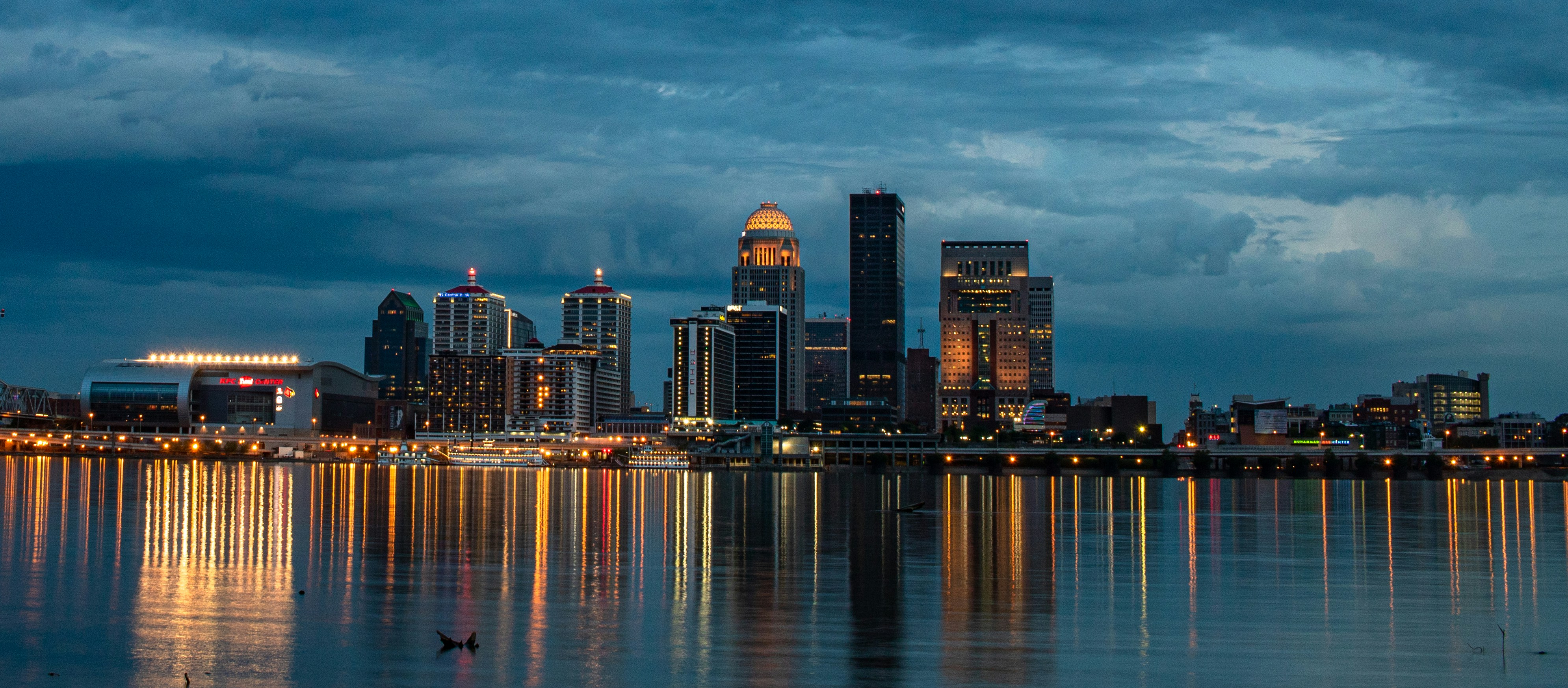 City skyline at dusk with water reflections