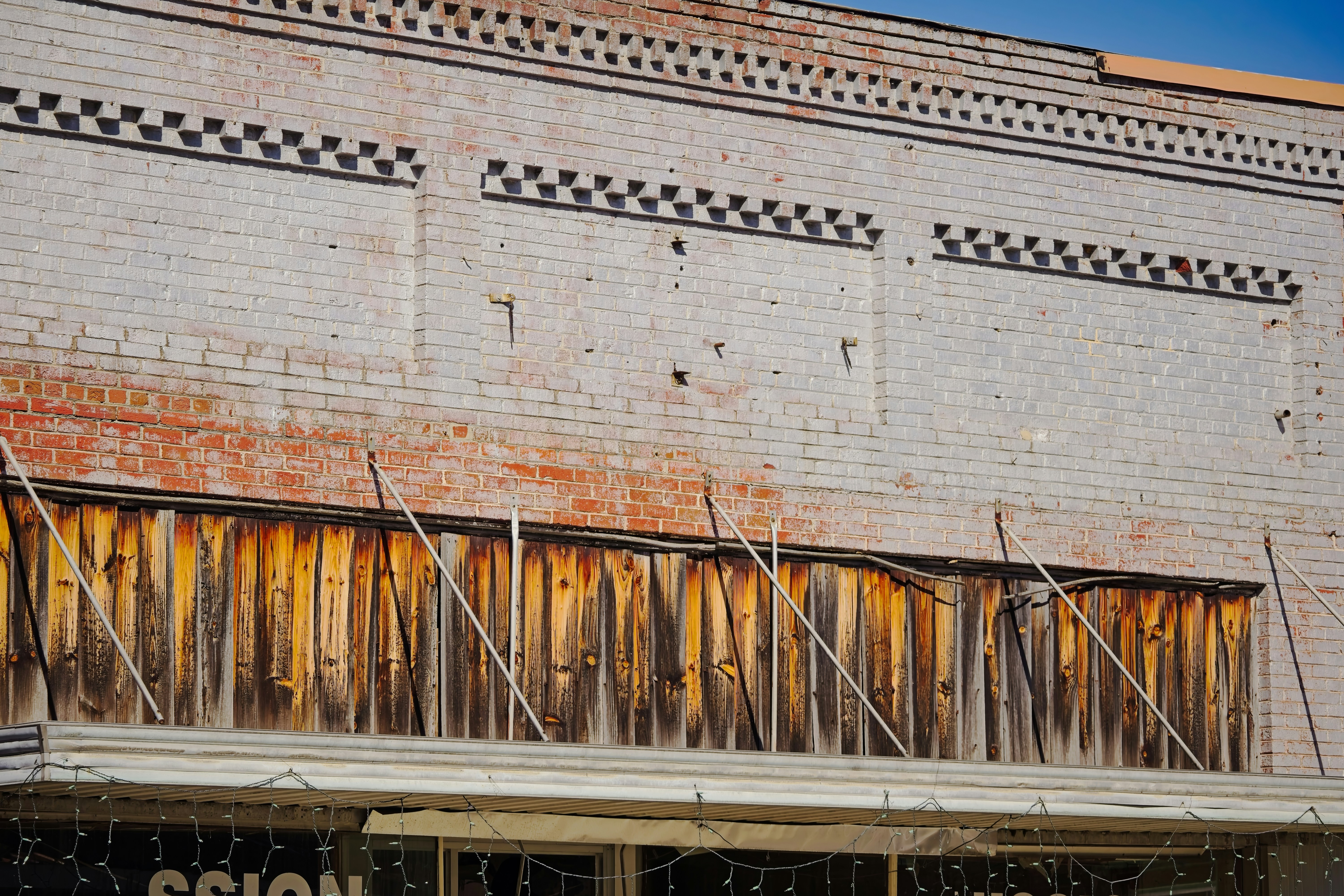 Weathered storefront with brick facade and vintage character