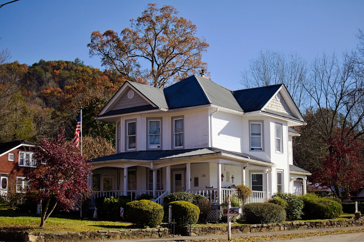 Historic two-story house with a wraparound porch