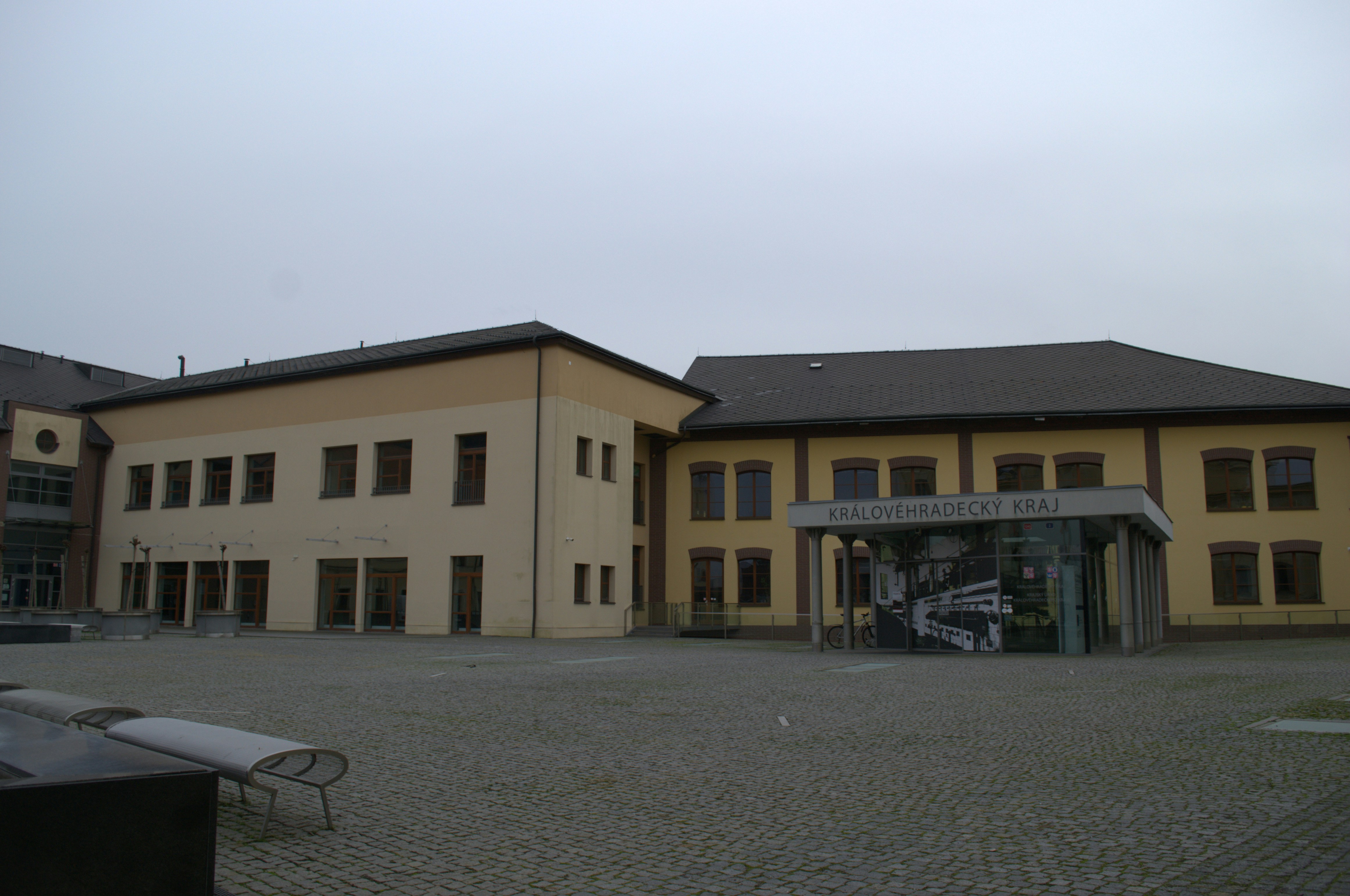 Modern building with glass entrance and courtyard