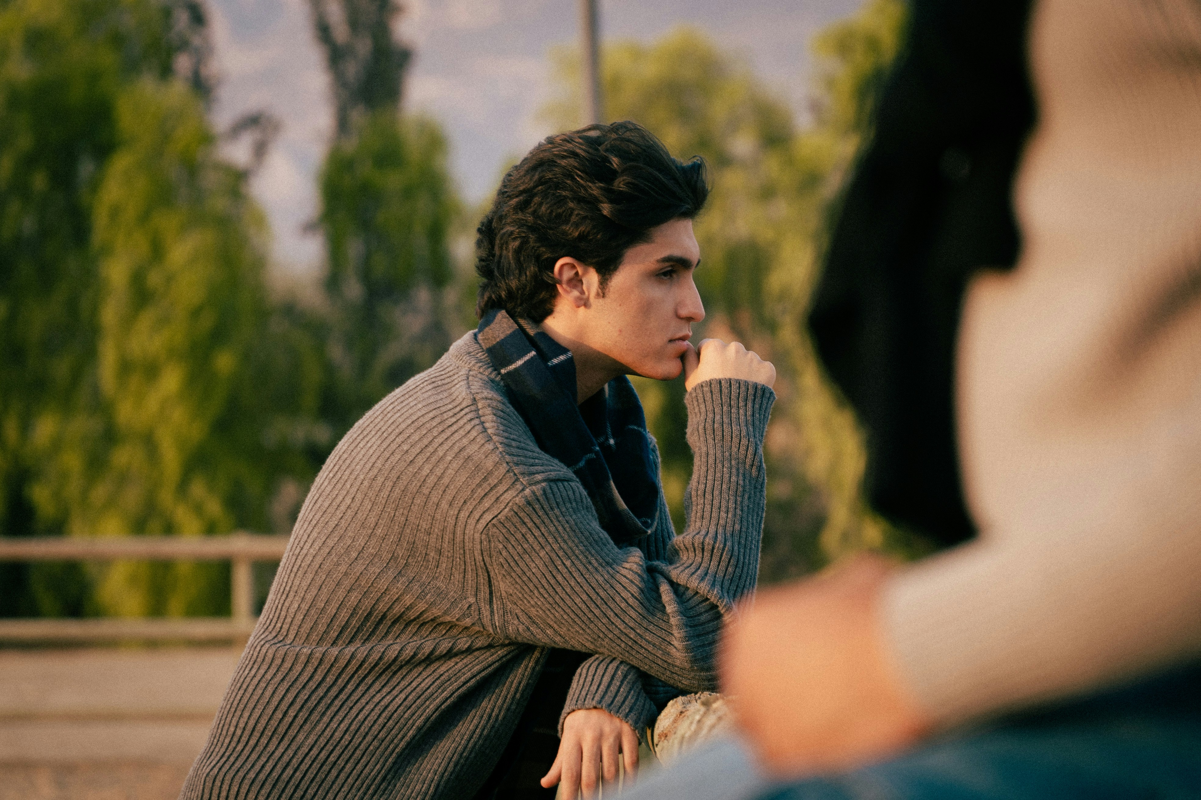 Young man looking thoughtfully into the distance