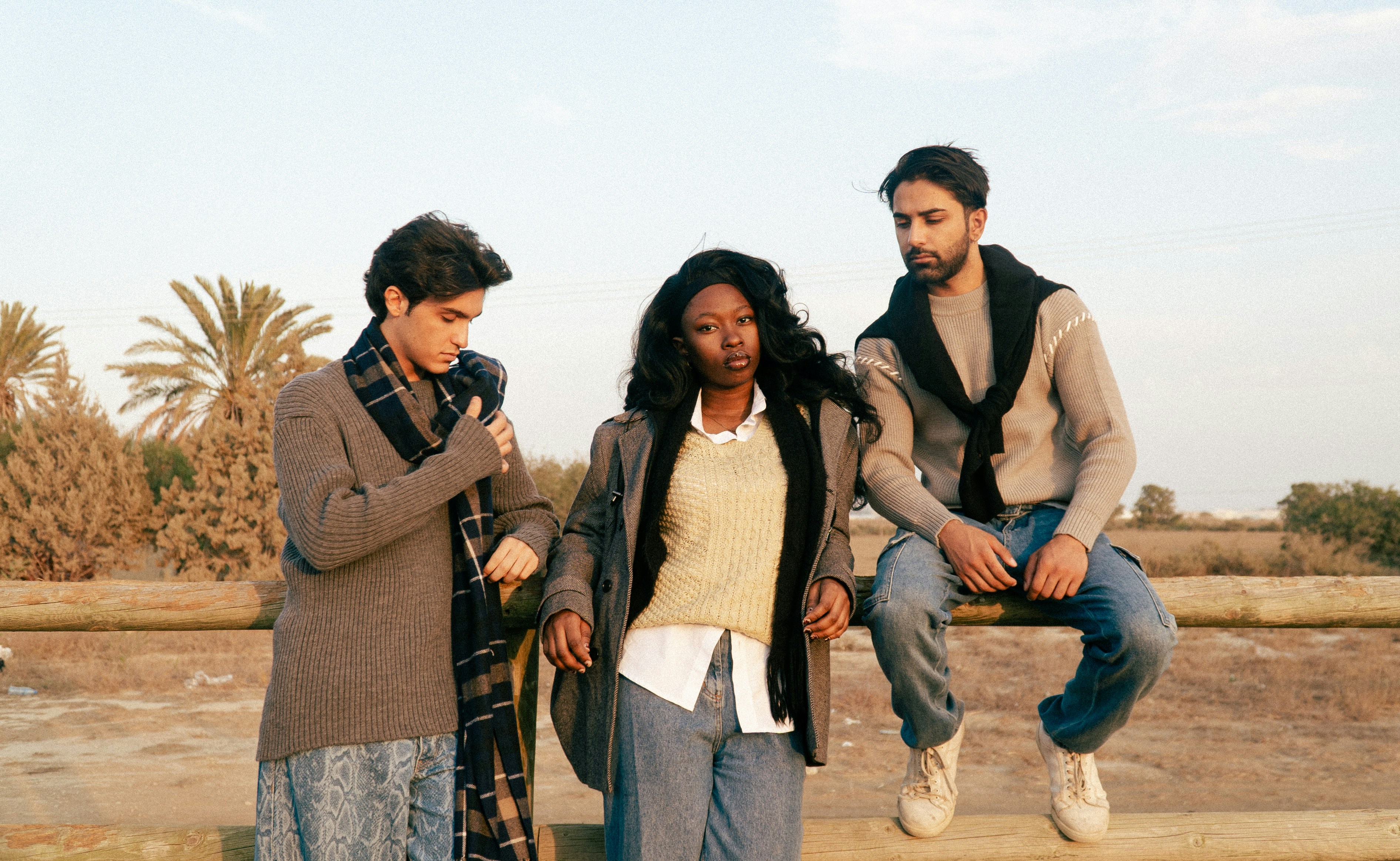 Three people with palm trees
