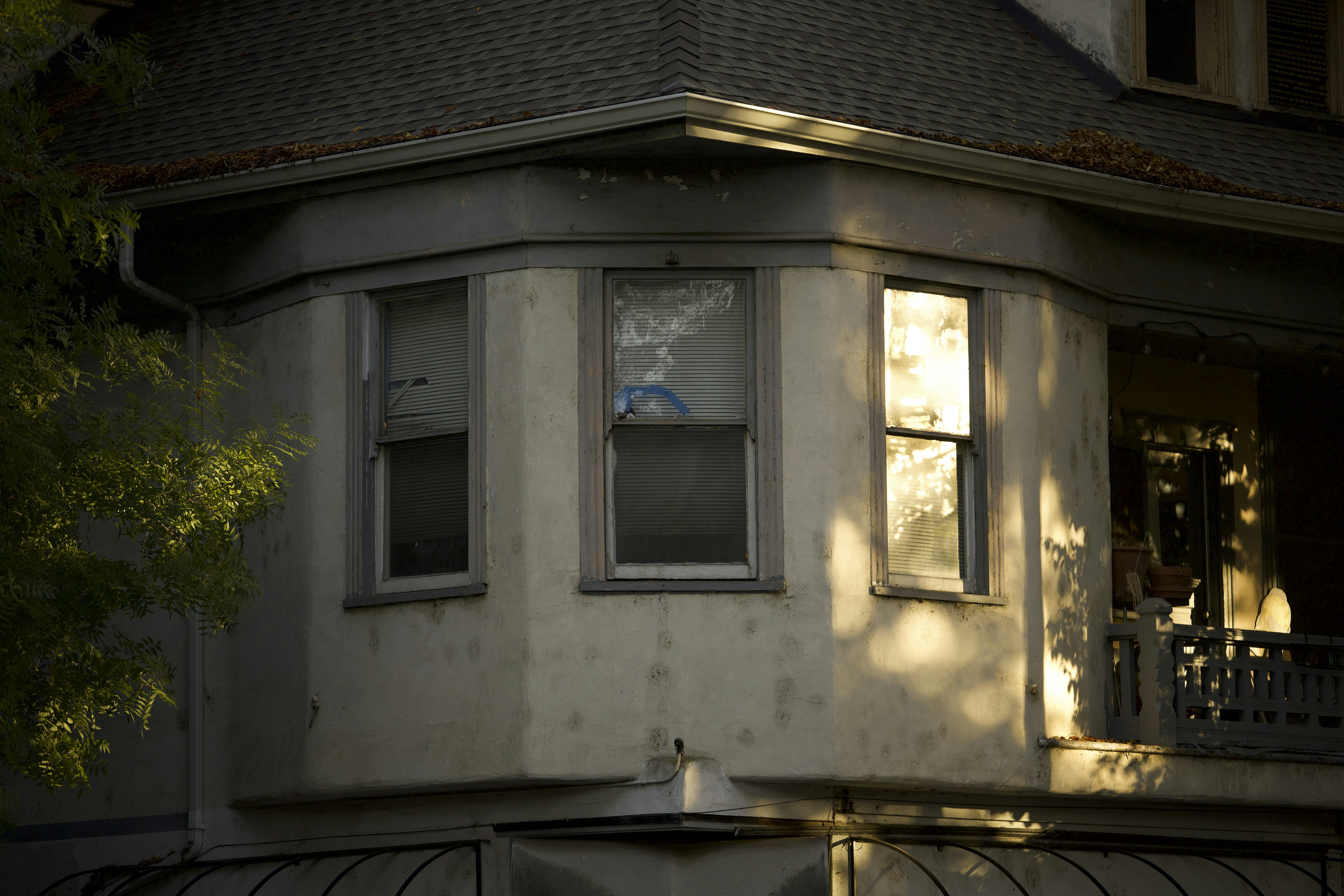 Bay window on an old house at sunset