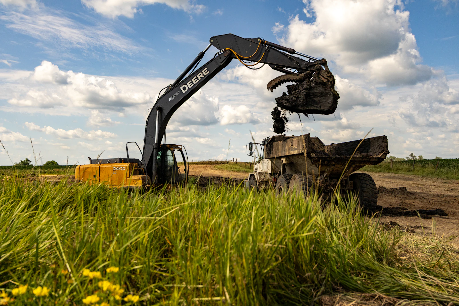 Excavator loading a dump truck