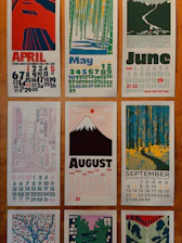 Calendar pages with artistic monthly illustrations.