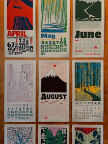 Calendar pages with artistic monthly illustrations.