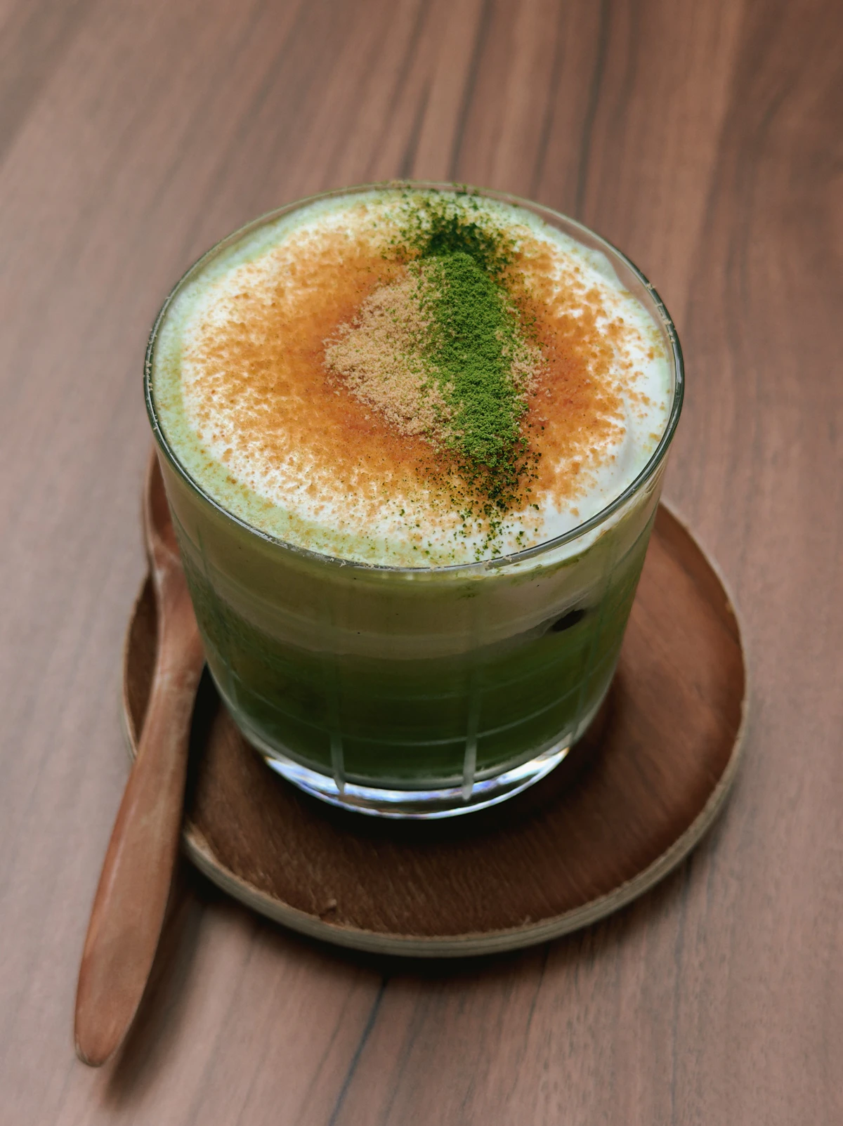 Layered matcha latte with foam topping