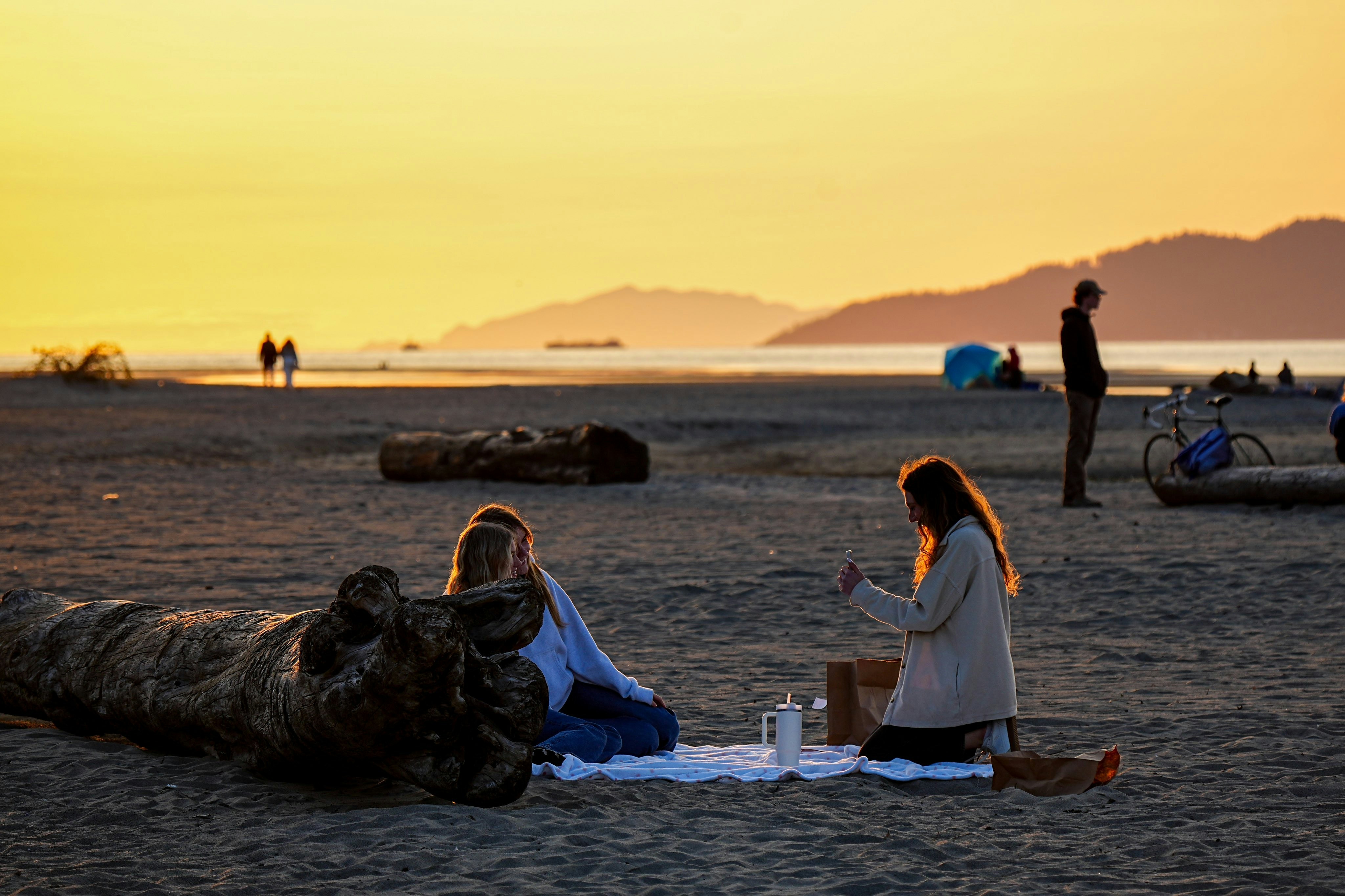 Couple enjoying a romantic dinner by the beach at a luxurious resort