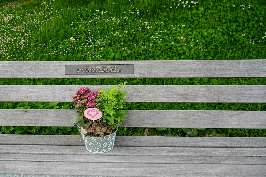A memorial bench with flowers, a quiet place to remember
