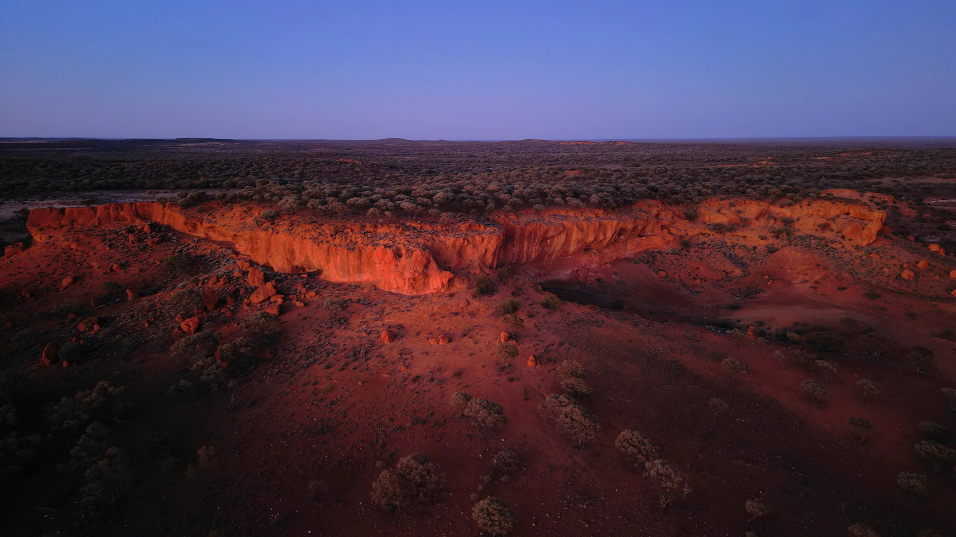 Red rock formations under a twilight sky