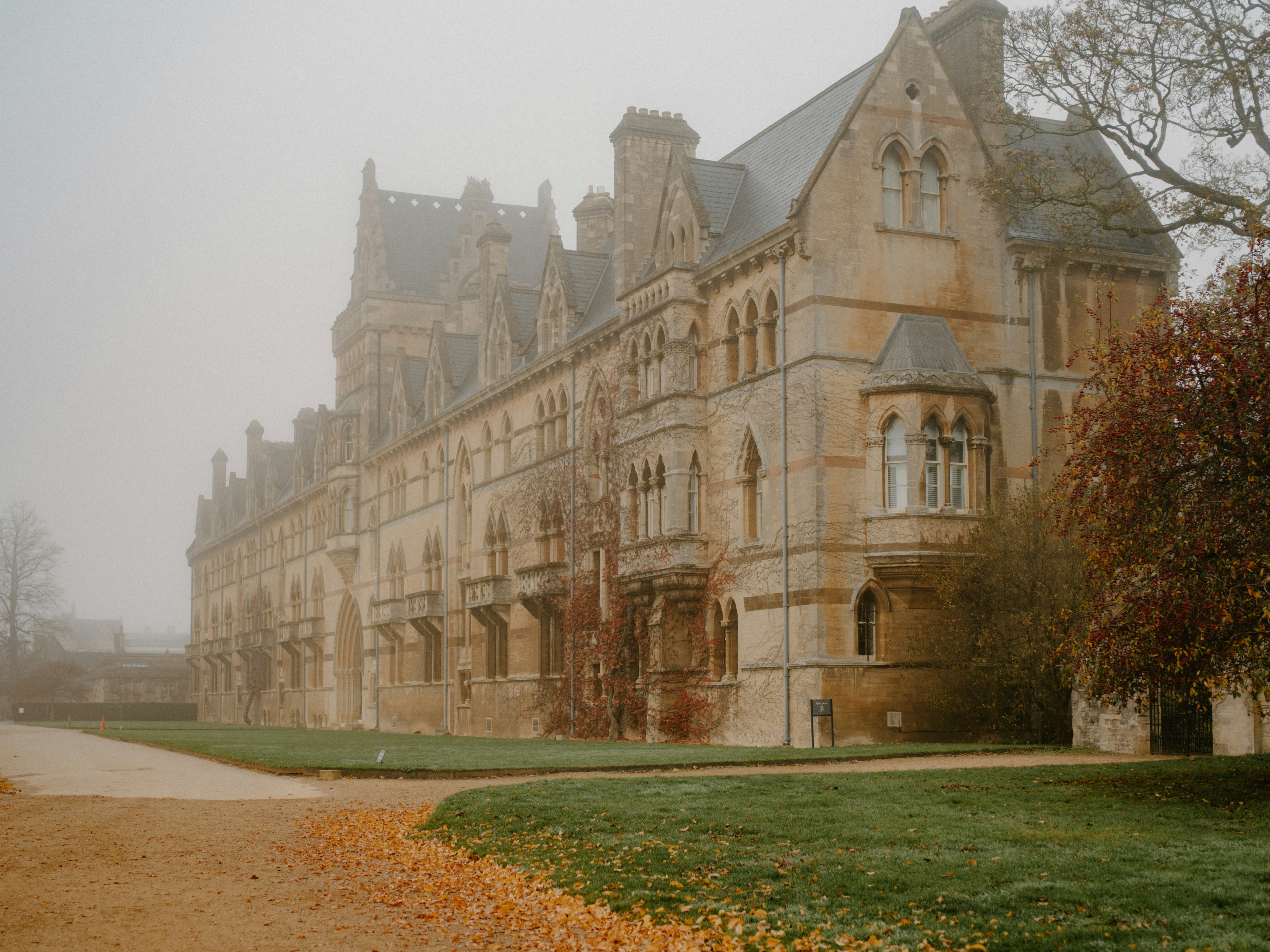 Historic stone building in foggy weather