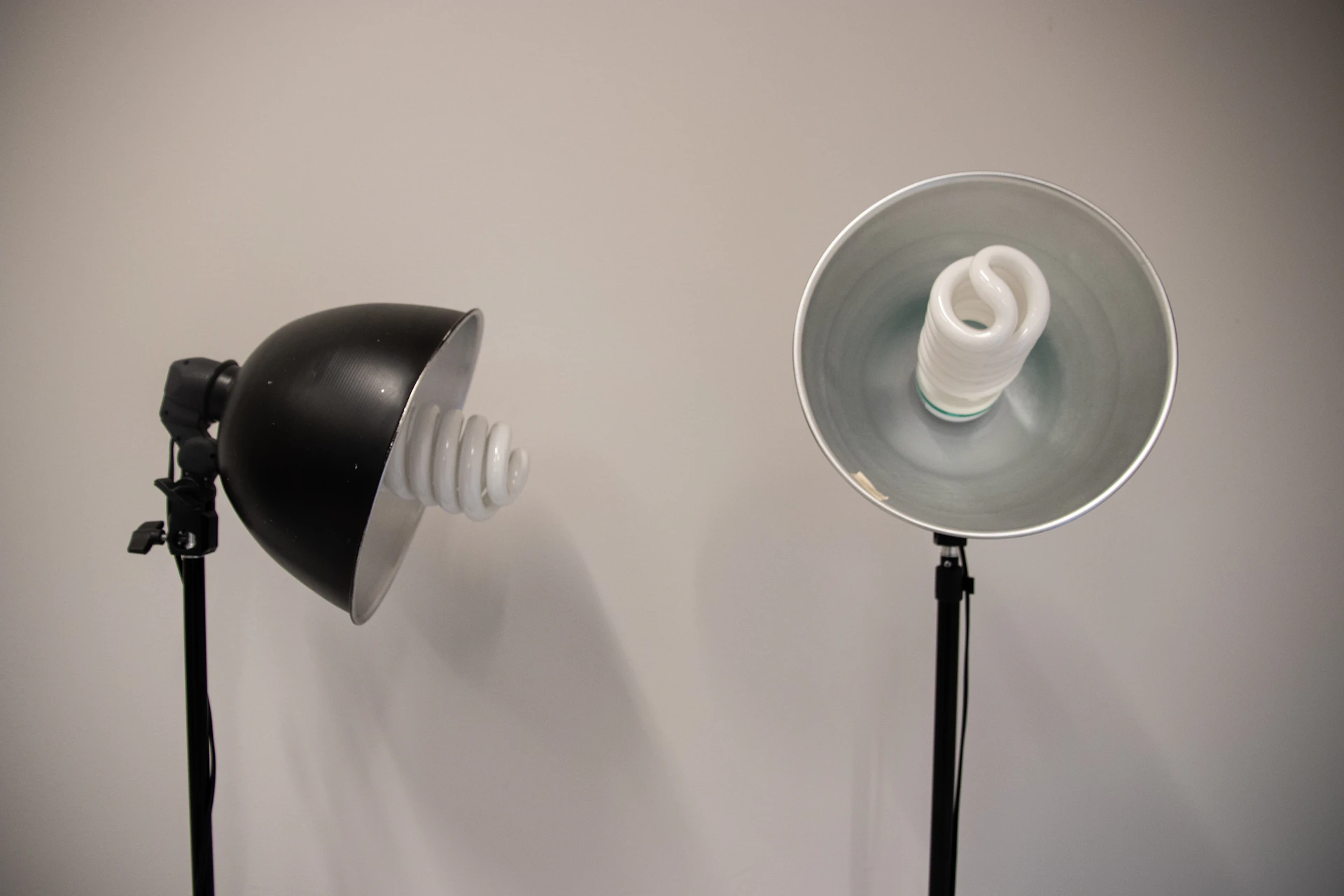Symmetrical studio light stands set up for a commercial product photography shoot