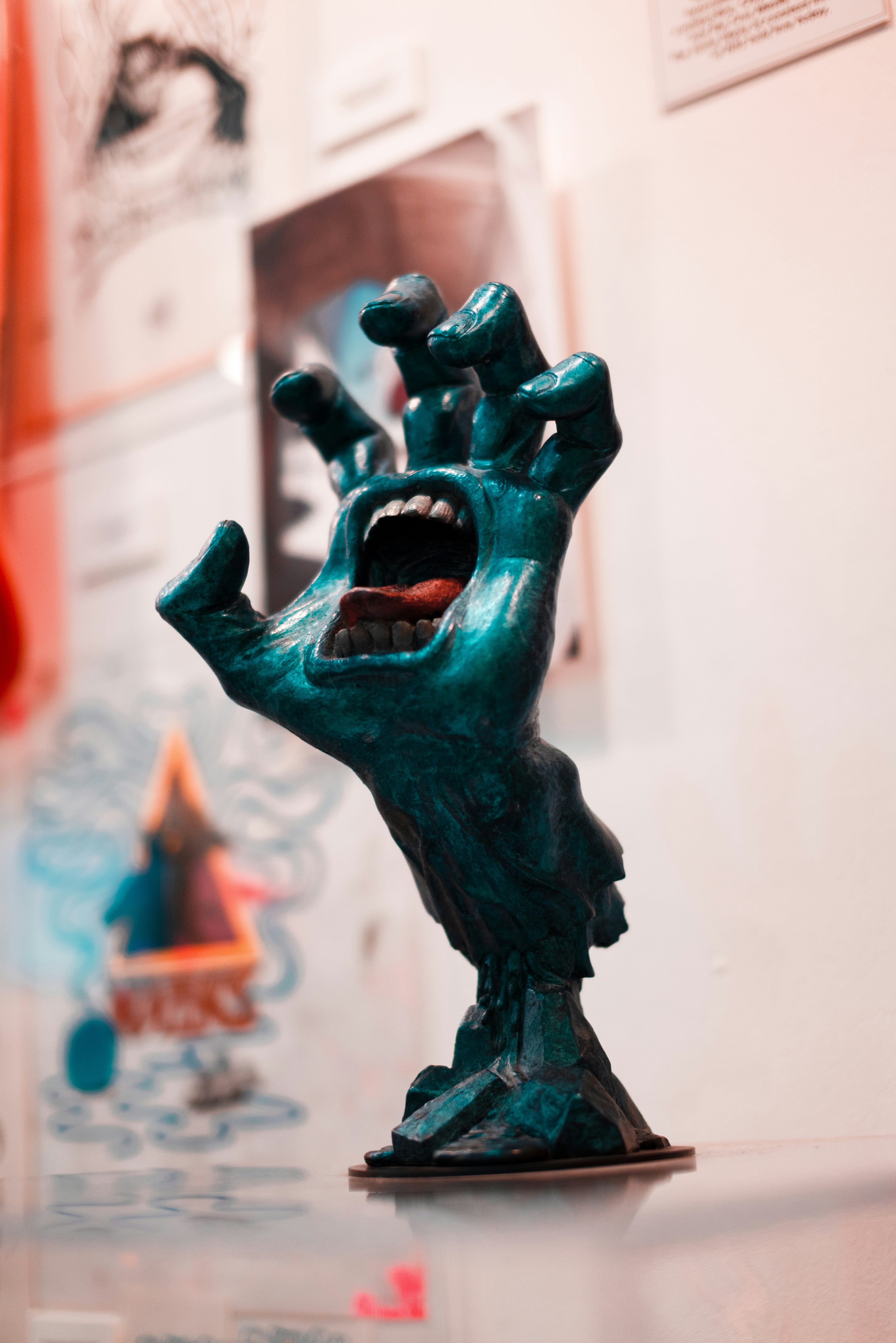 Screaming hand sculpture with open mouth and teeth