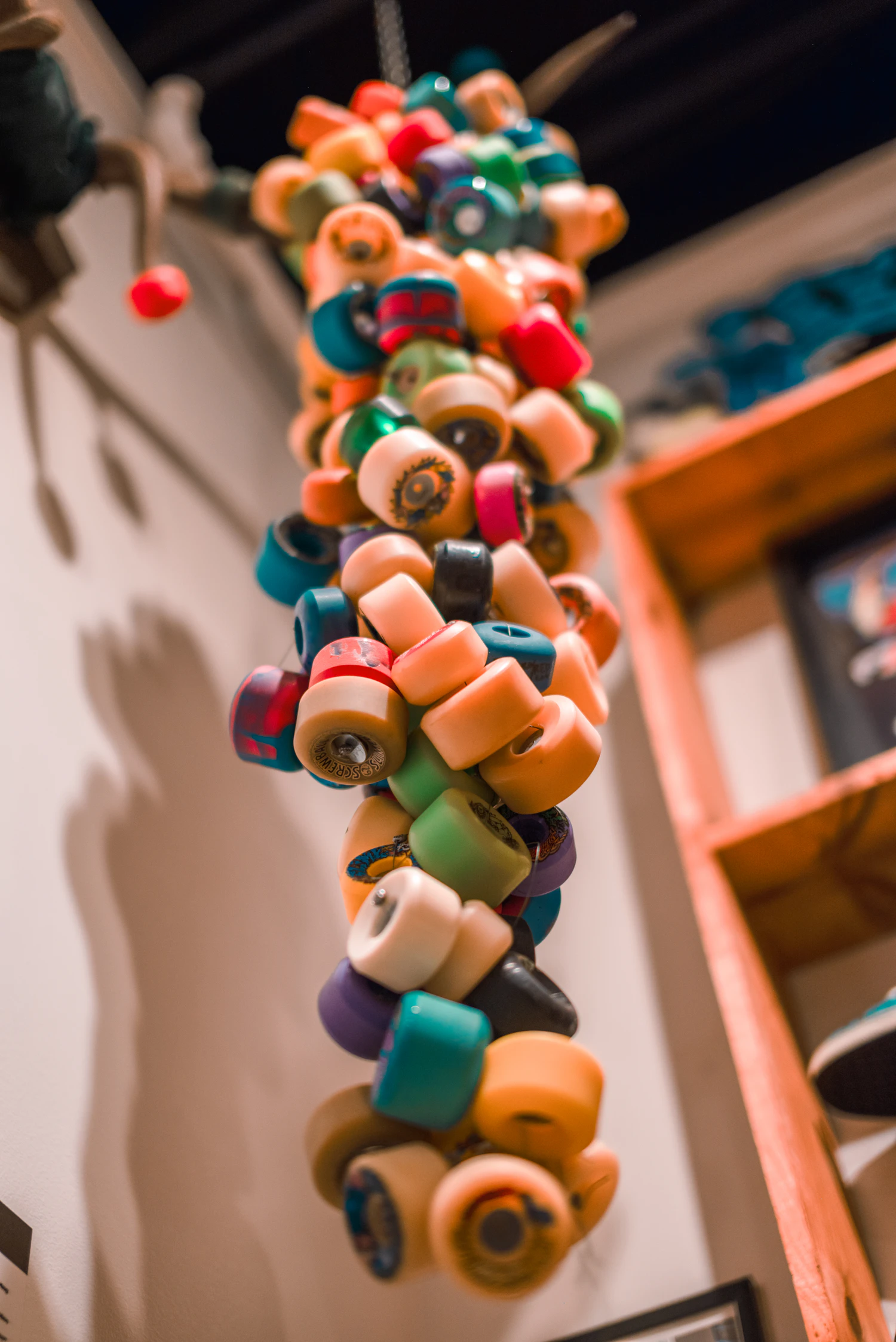 Roll Call wheels, a cluster of coloured wheels hanging by the counter