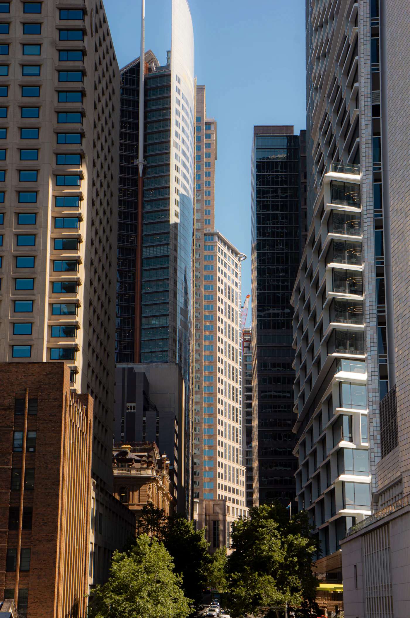 Modern office towers seen from a busy city street