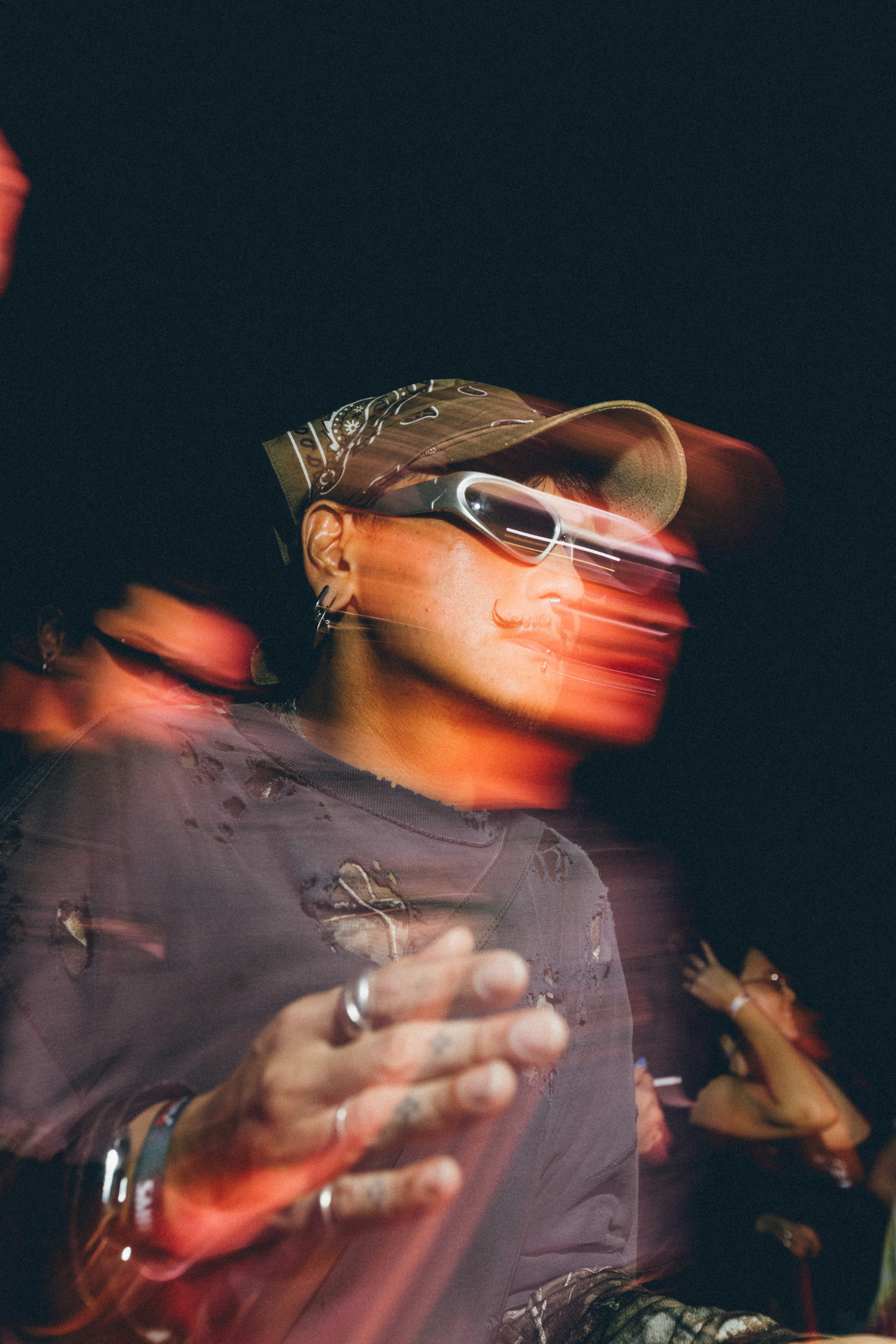 Man with sunglasses and bandana in motion blur