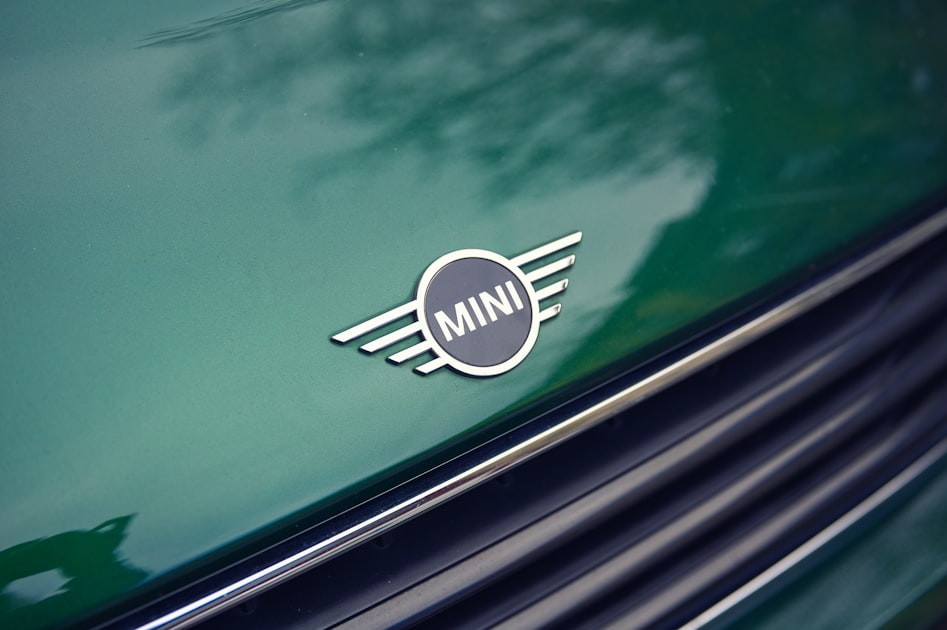 Green mini cooper emblem on car hood