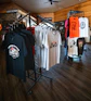 T-shirts displayed on racks in a retail store.