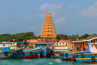 Boats docked near a golden temple structure