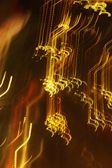 Abstract streaks of golden light at night