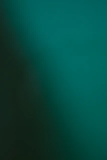 Dark teal and green gradient background
