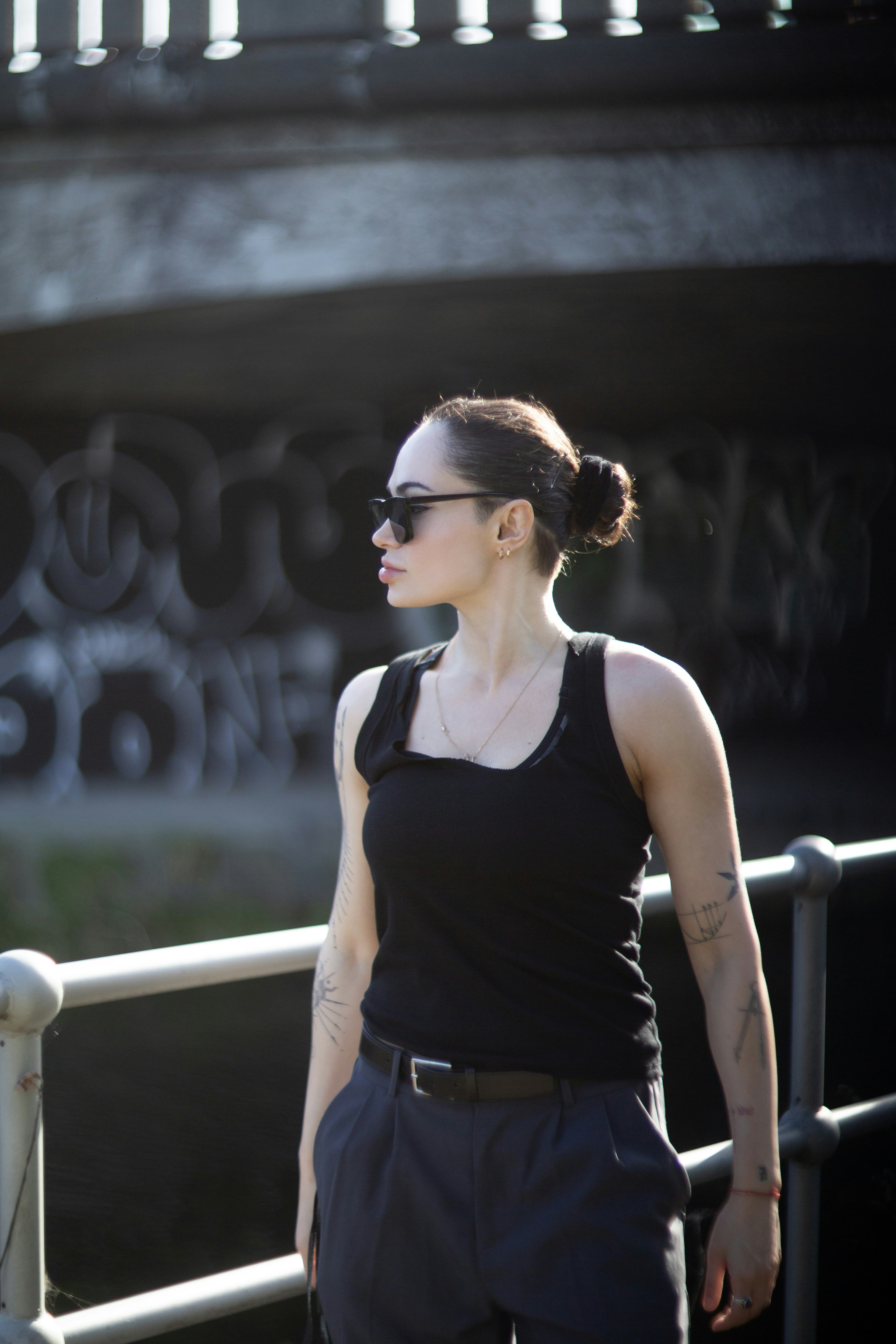 Woman in sunglasses looking away from camera