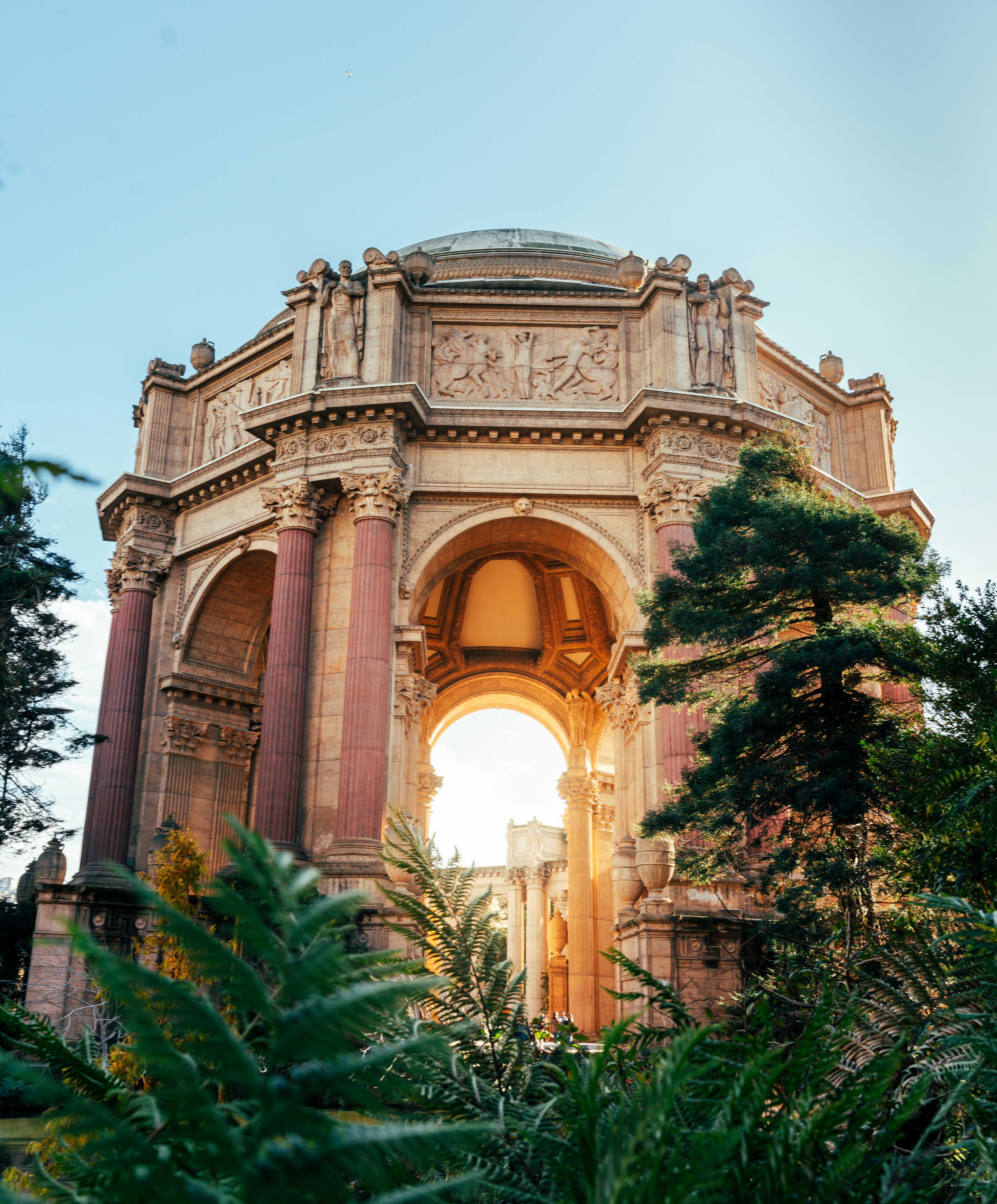 Ornate building with trees and sunset glow