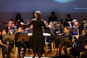 Conductor leads orchestra during a performance