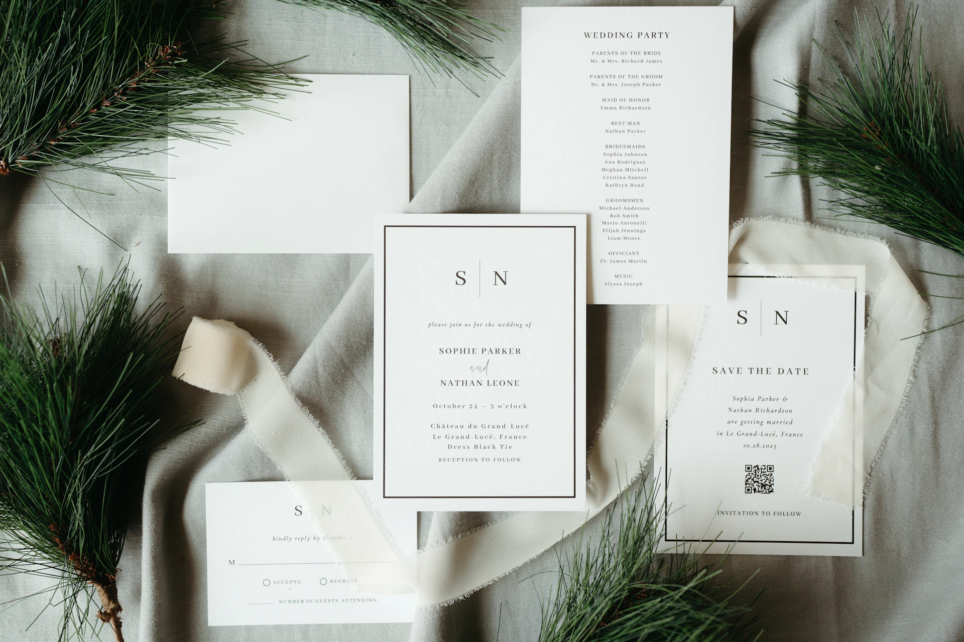Wedding invitations with pine branches and ribbon