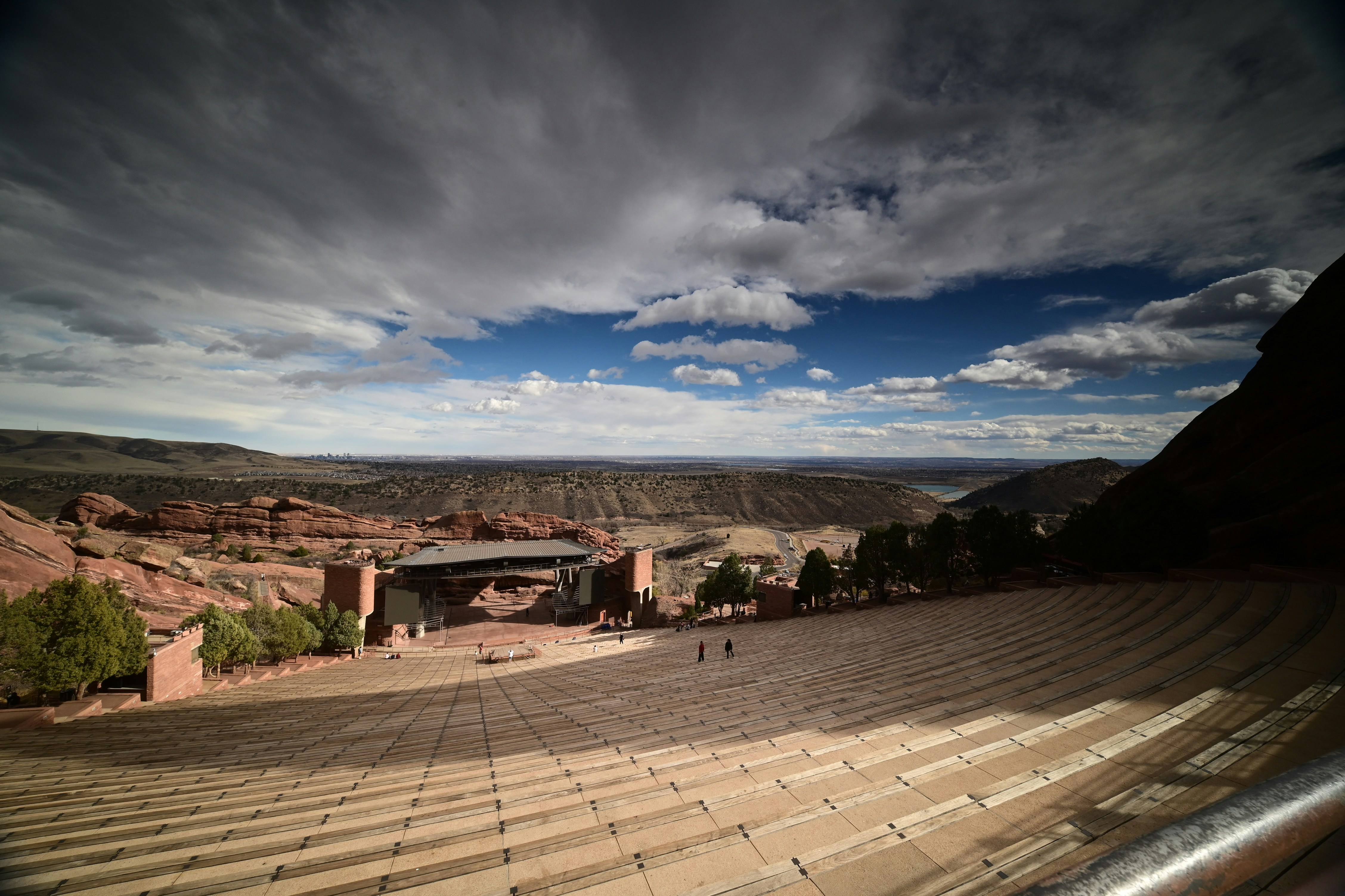 Amphitheater in a rocky landscape under a cloudy sky
