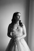 Young woman in a formal gown holding a bouquet