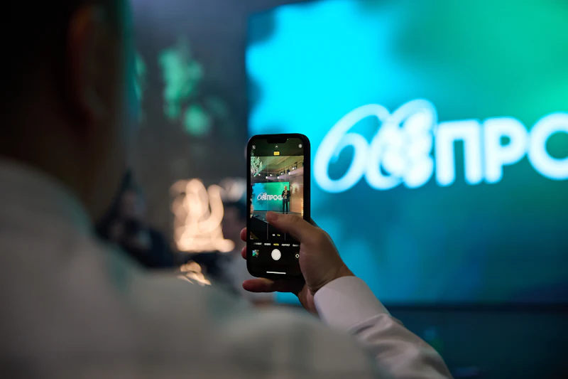 Someone capturing a big live screen with their phone