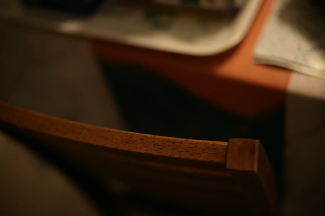 Close detail of an oak chair frame showing warm wood grain