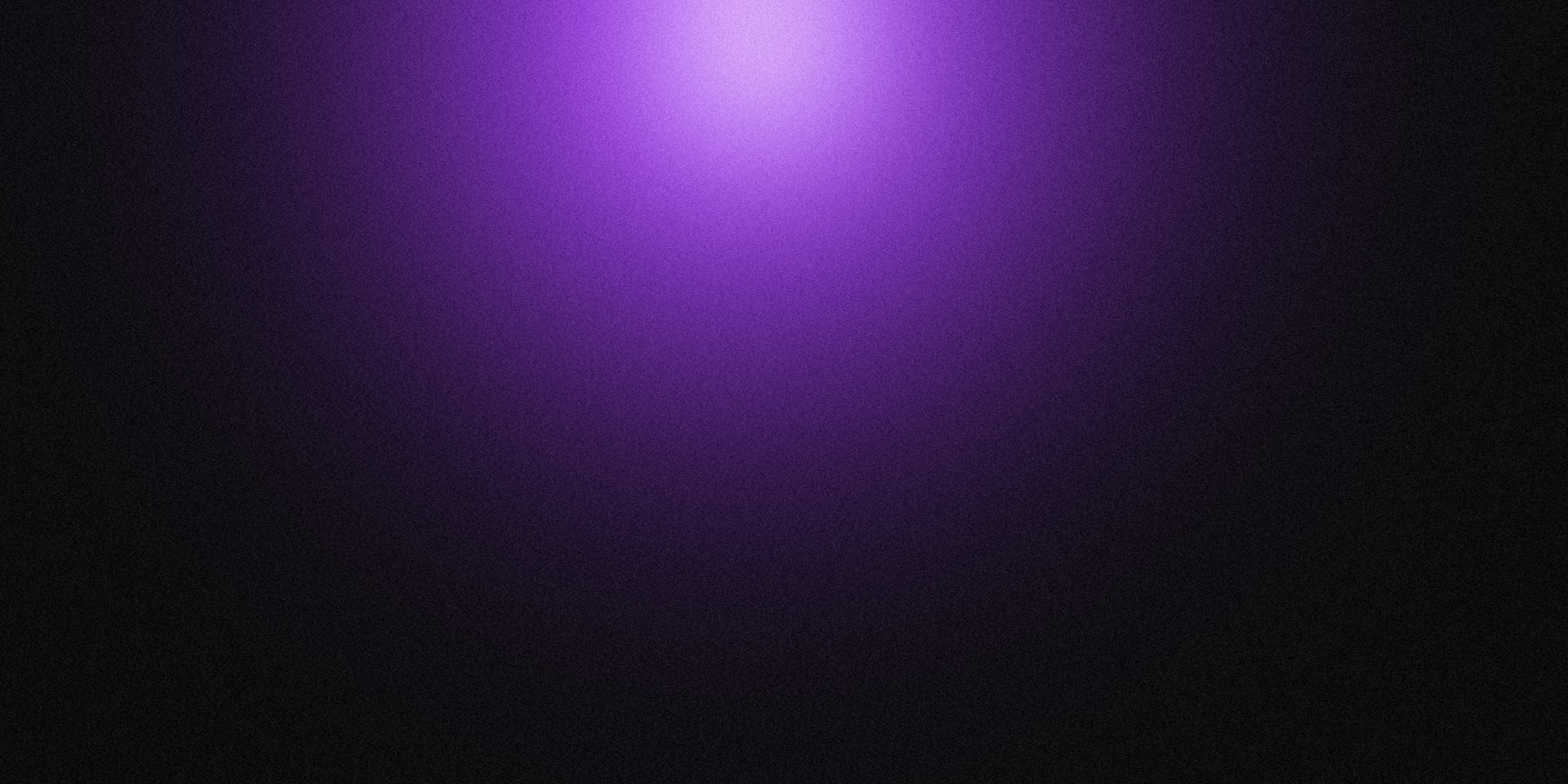A gradient of purple fading to black