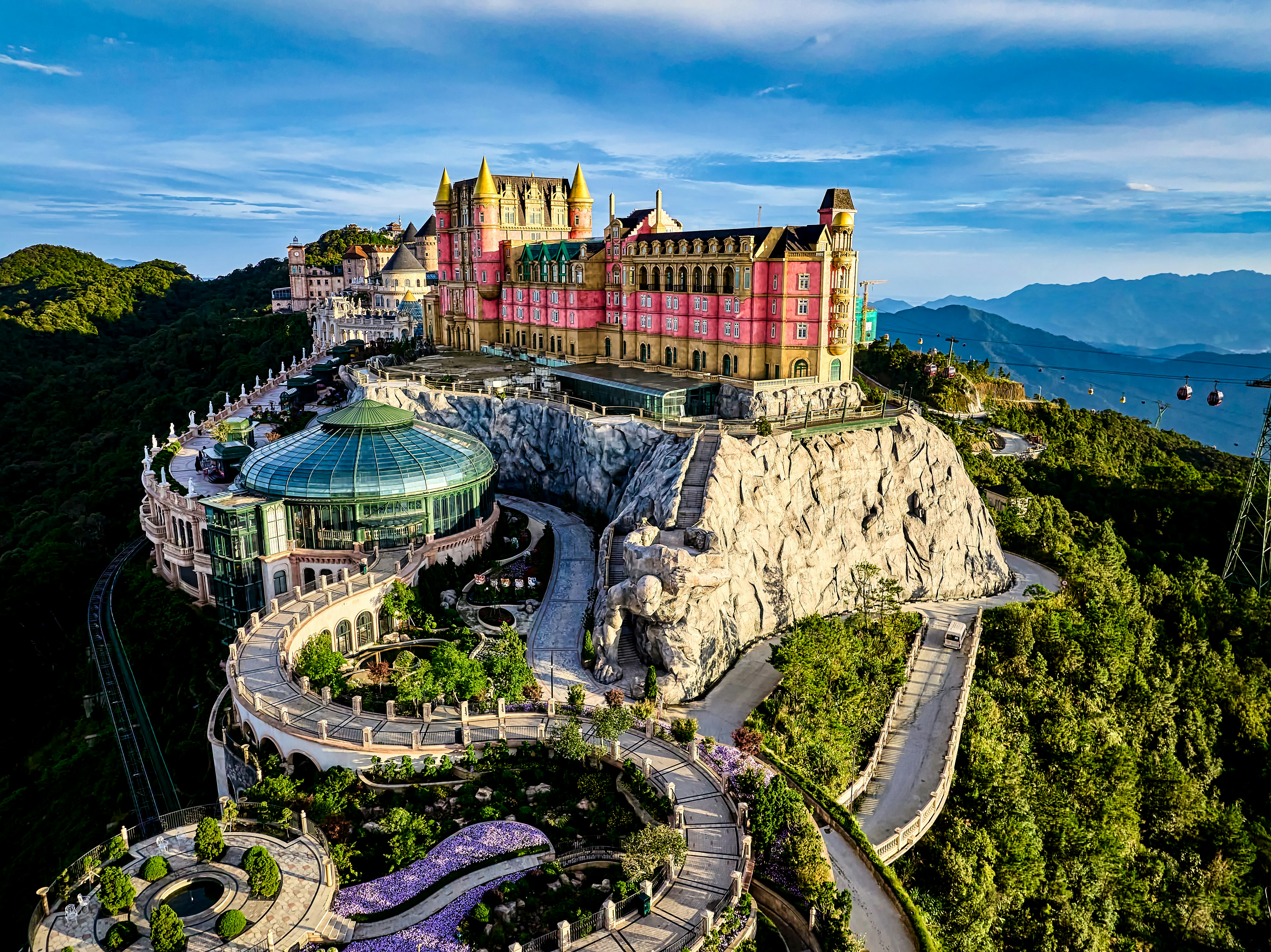 Castle resort on a lush green mountain landscape