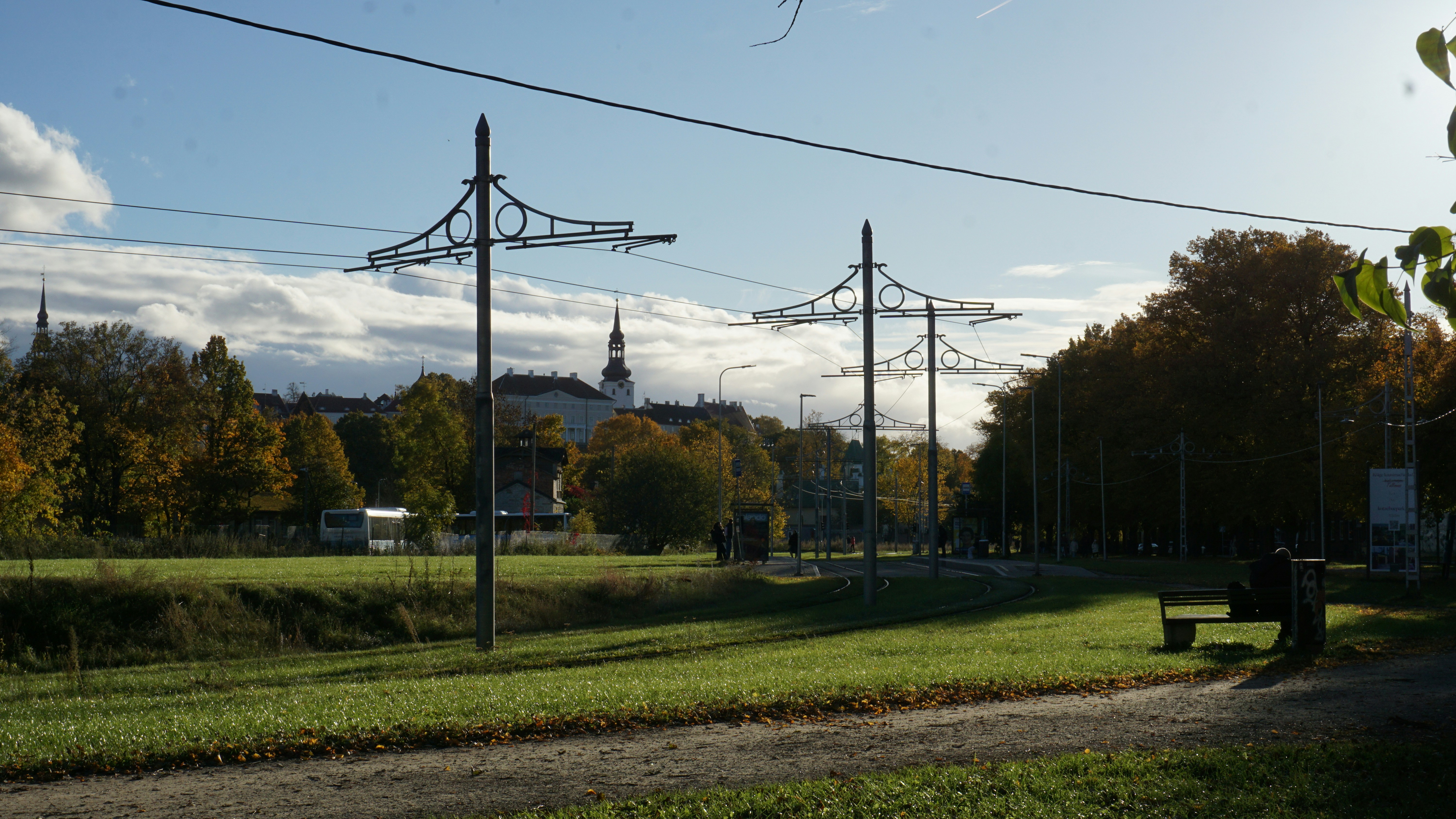 Tall towers with wires in a park setting.