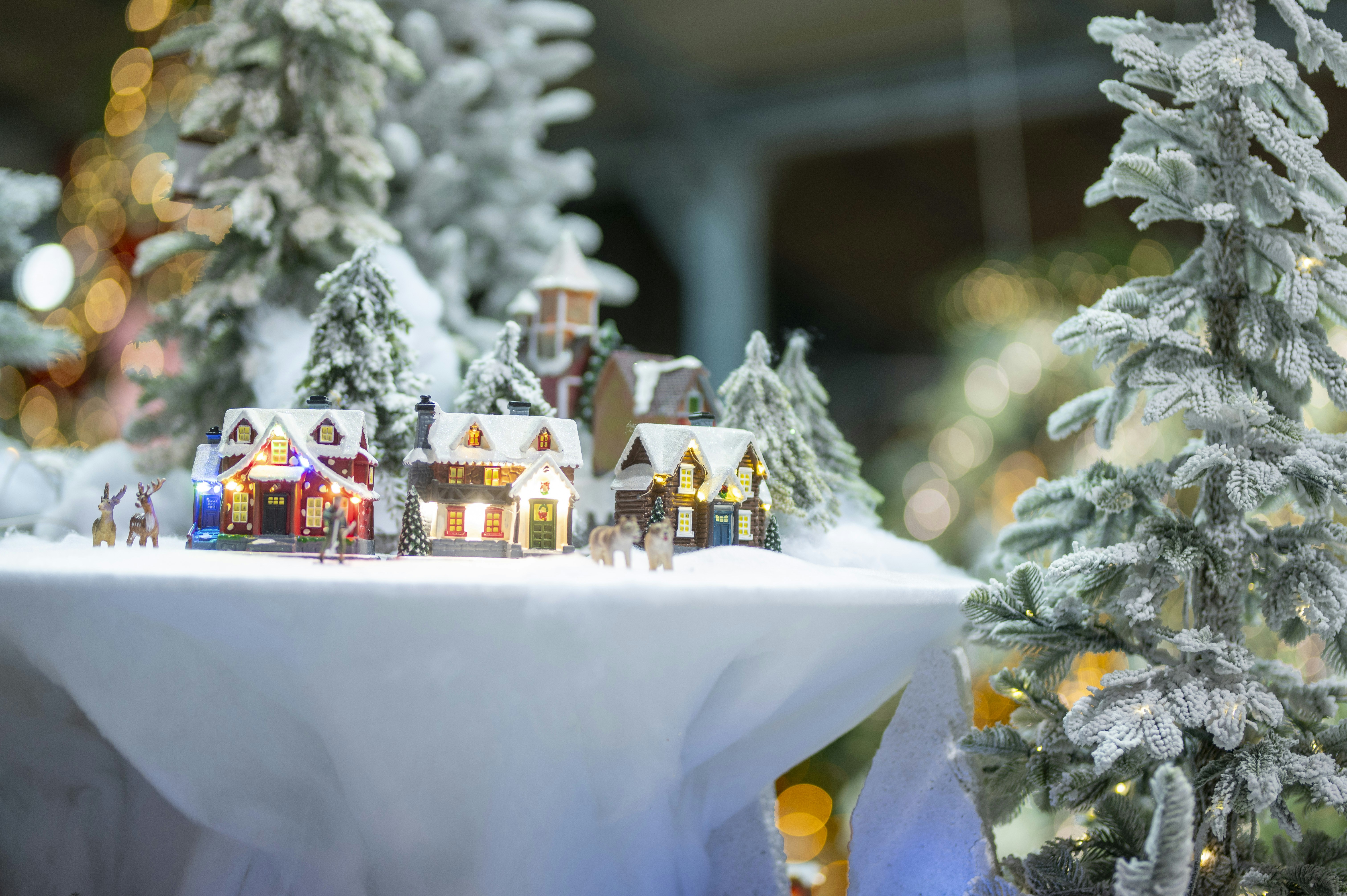 Miniature snowy village with festive lights